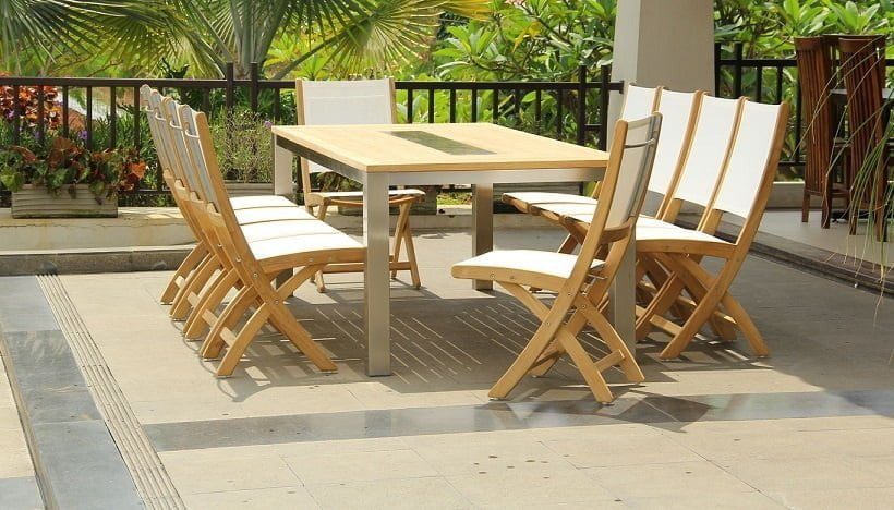 Teak stainless steel outdoor dining set with rectangular teak table and Rivera folding chairs