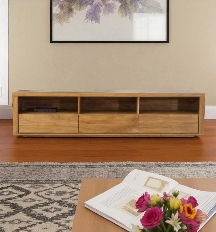 Three open shelves of the Casa Bella Designs Teak Wood Media Center for housing electronics.