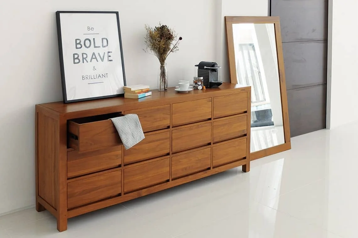 Minimalist solid wood chest of drawers featuring a sleek, clean design with smooth lines and natural wood finish. Ideal for modern and contemporary interiors, offering ample storage space with a simple, elegant look.