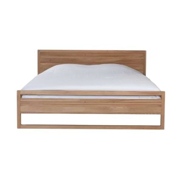 Teak wood bed frame with a natural brown finish in a modern bedroom setting